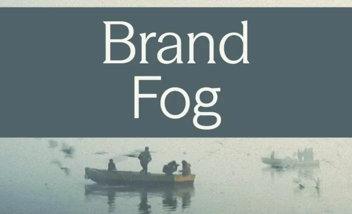 Boats in fog with written title 'Brand Fog'